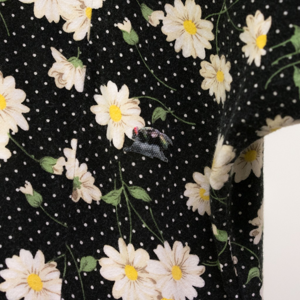 housefly patch on a black floral dress