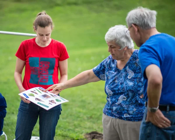 Amendments_081916pillsart041 copy three people look at examples of custom patches designed to represent their blocks in Central and Powderhorn neighborhoods